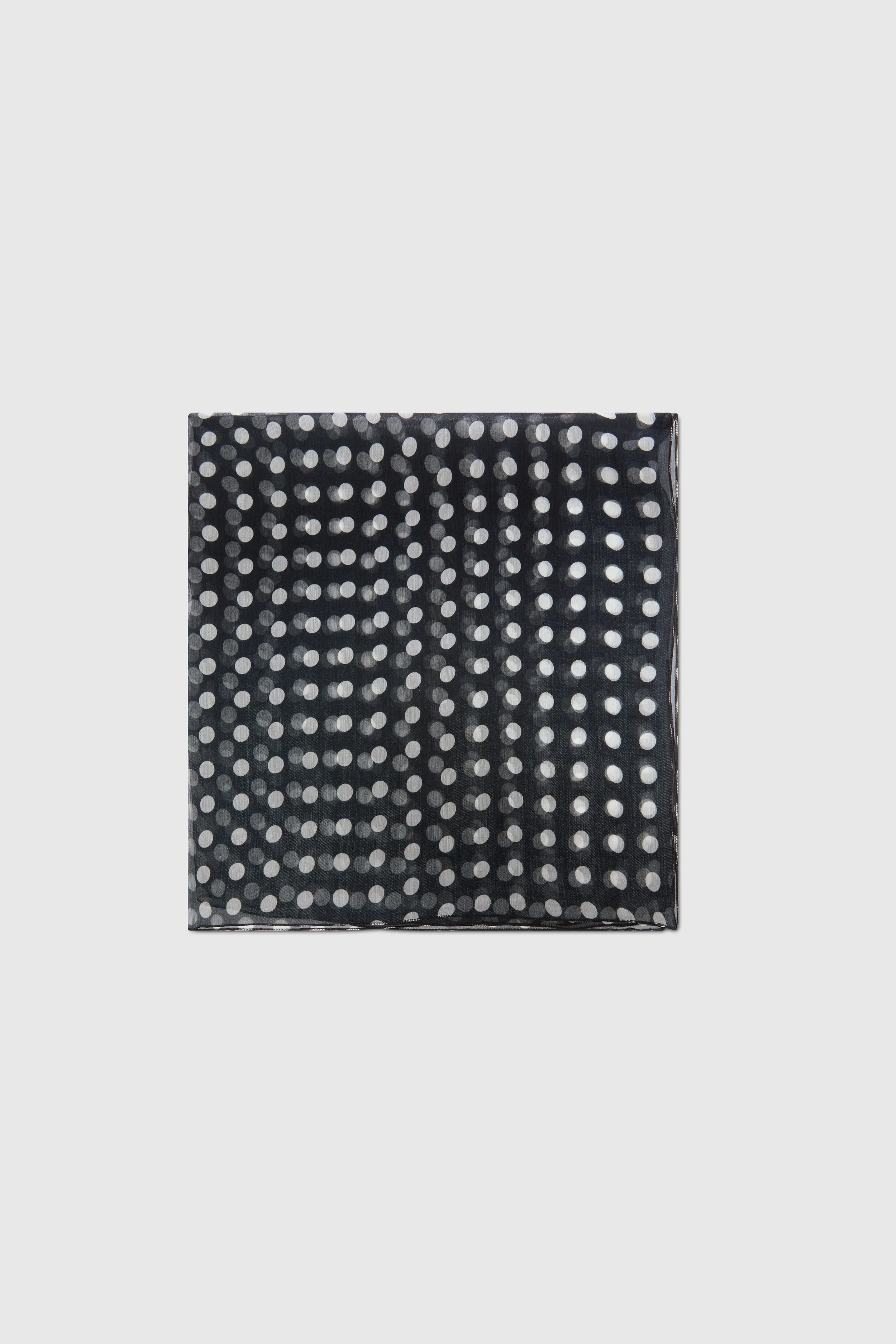 Square silk scarf with white polka dots on black background